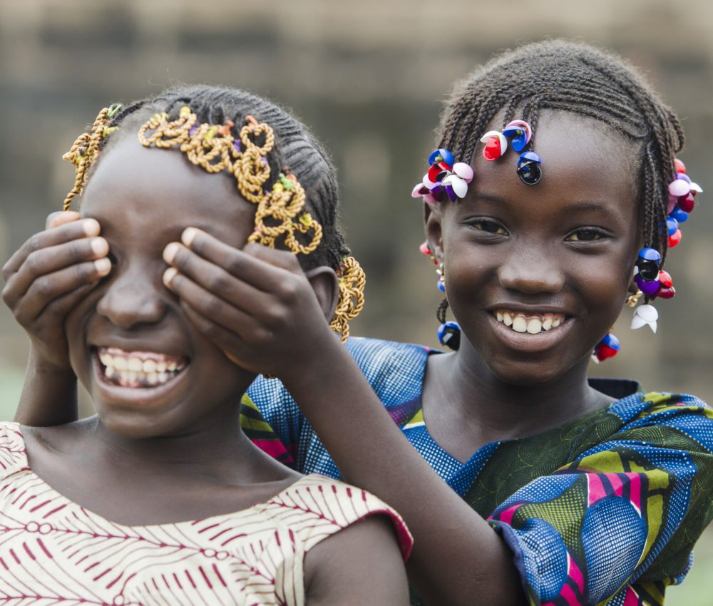 African,Girls,Playing,Peekaboo,Outdoors,Laughing,And,Smiling,Together,(happiness